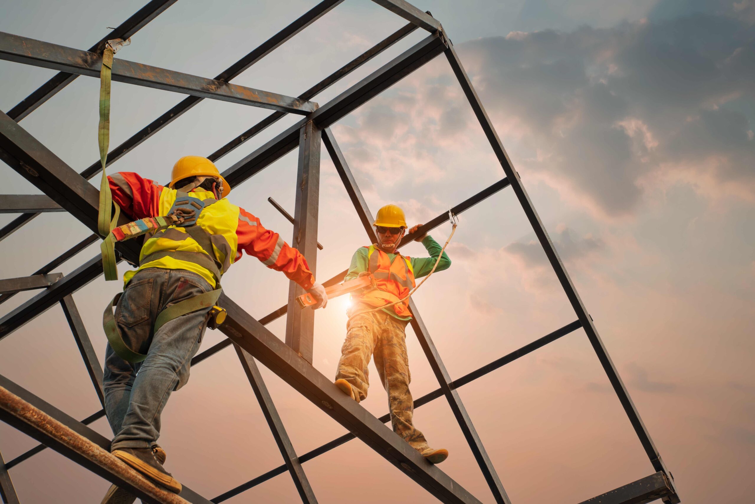 Construction,Workers,Wear,Safety,Belts,During,Work,On,Building,Roof